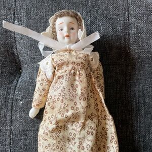 Vintage 8” doll with ceramic head, feet and hands.